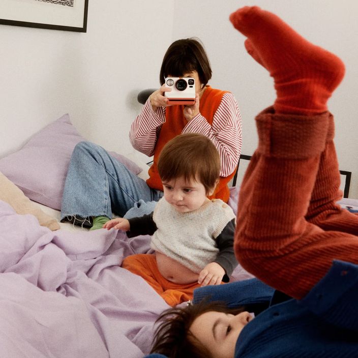 A photo album with Polaroid photos