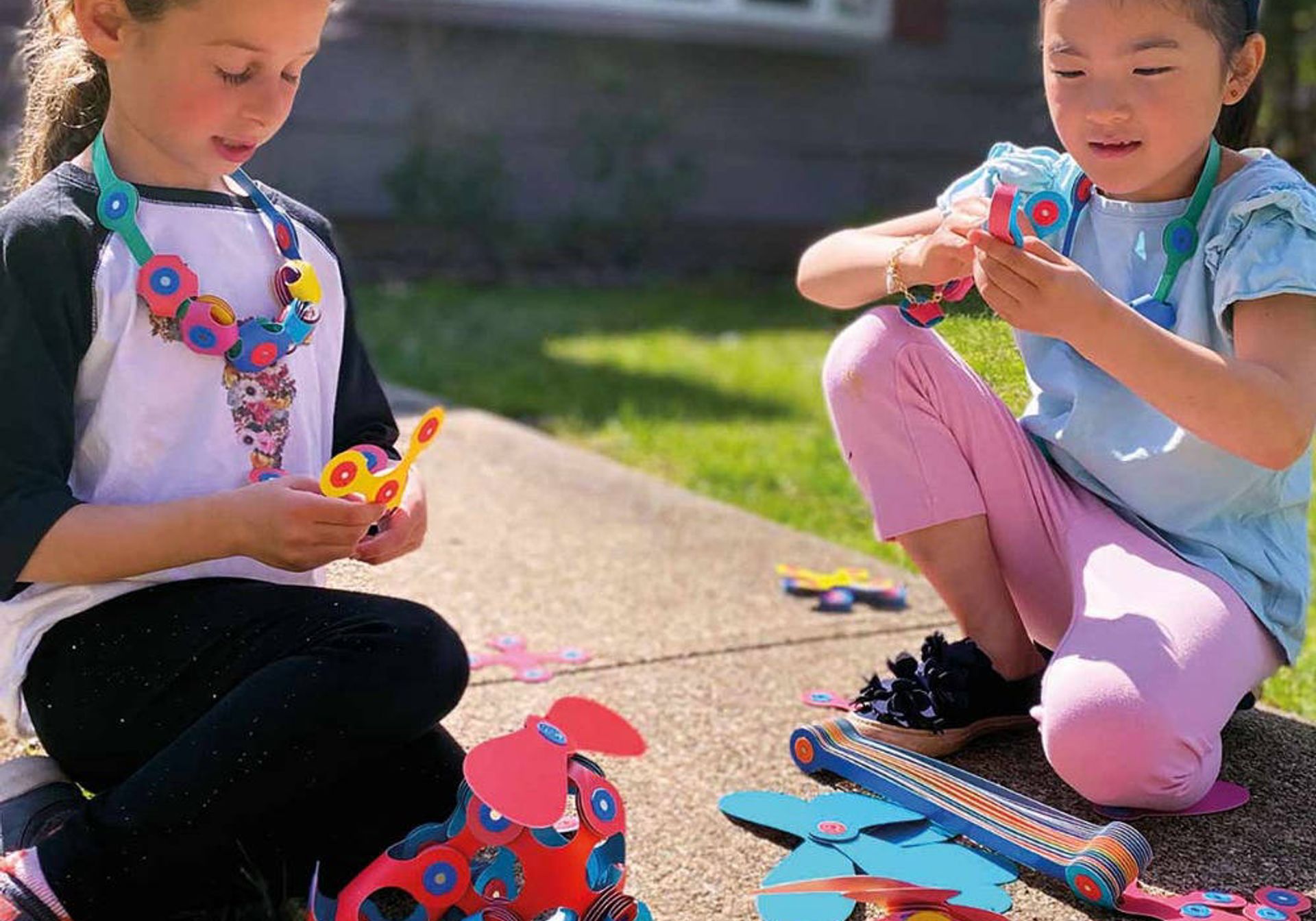 Girls playing with Clixo Super Rainbow