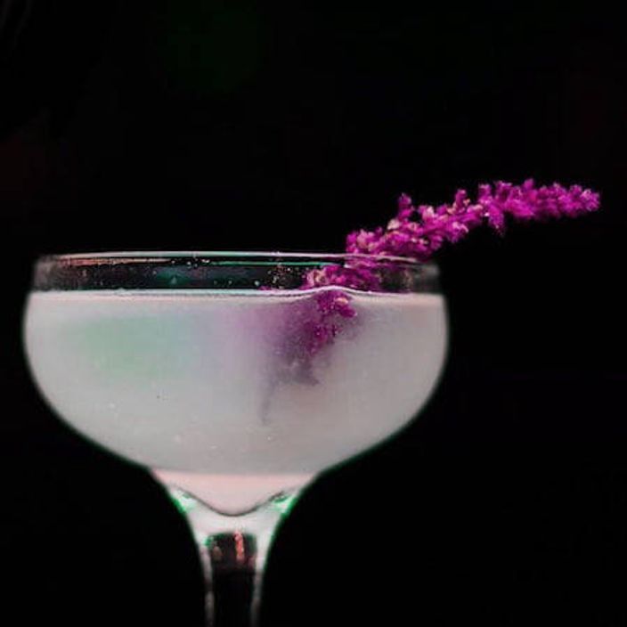 Cocktail with purple flowers