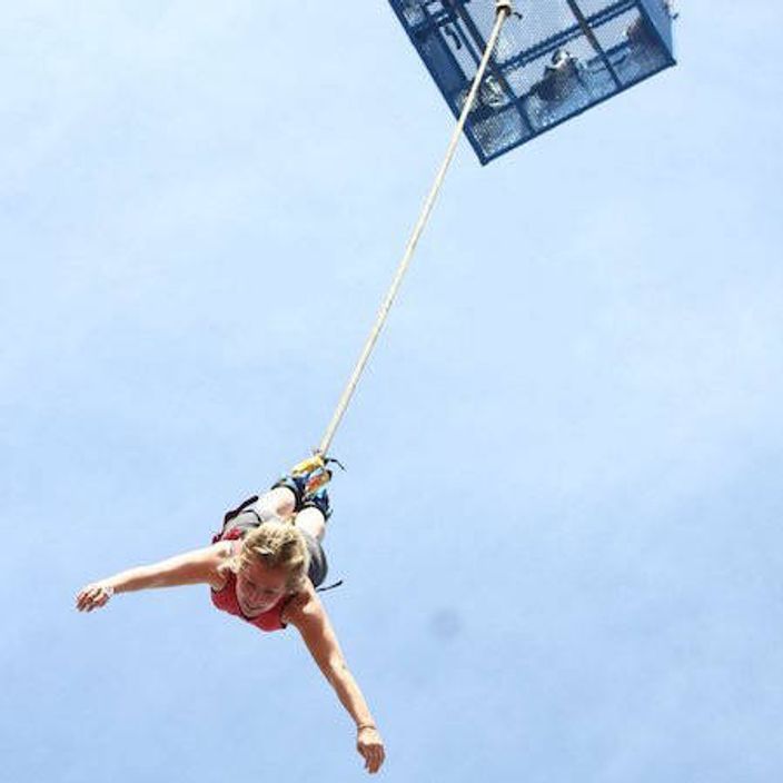Woman bungee jumping
