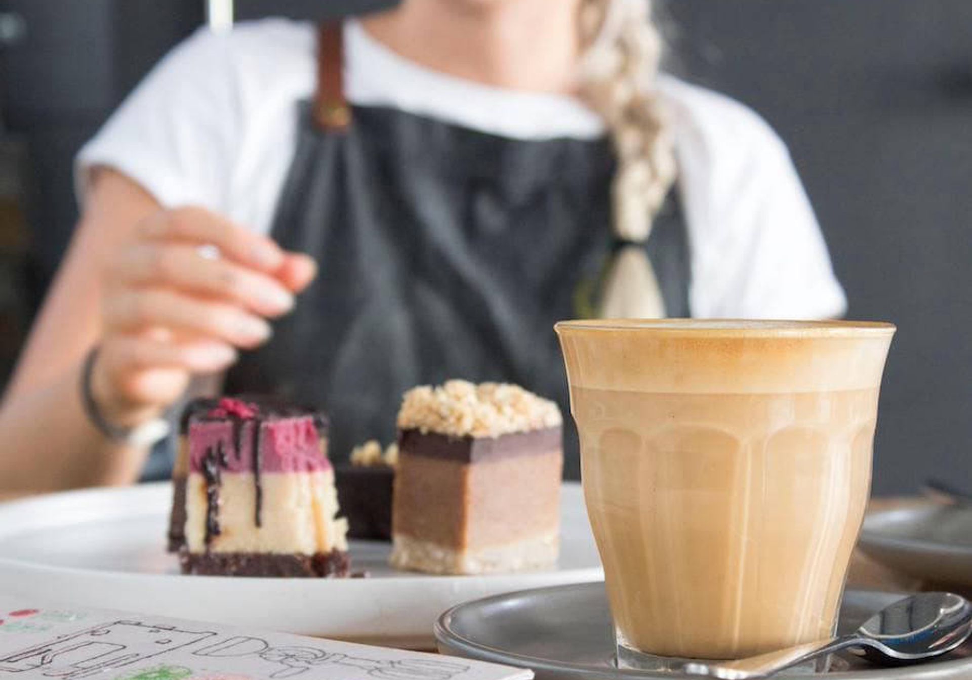 Waitress serving coffee and cake