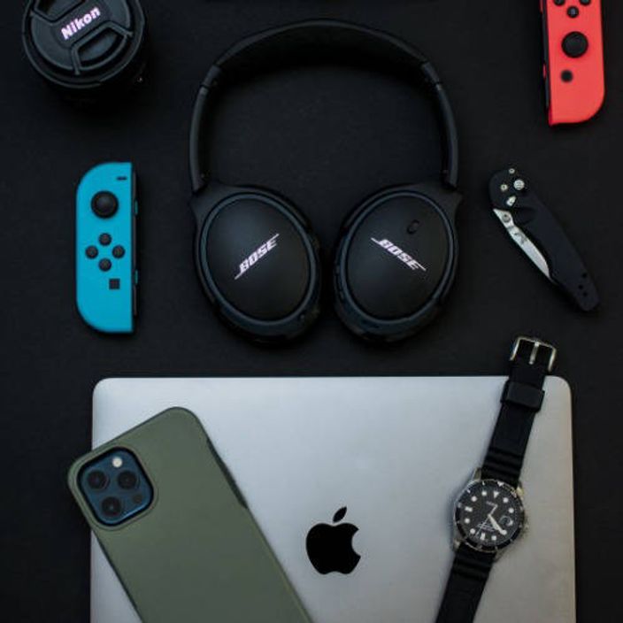 Various gadgets on black table