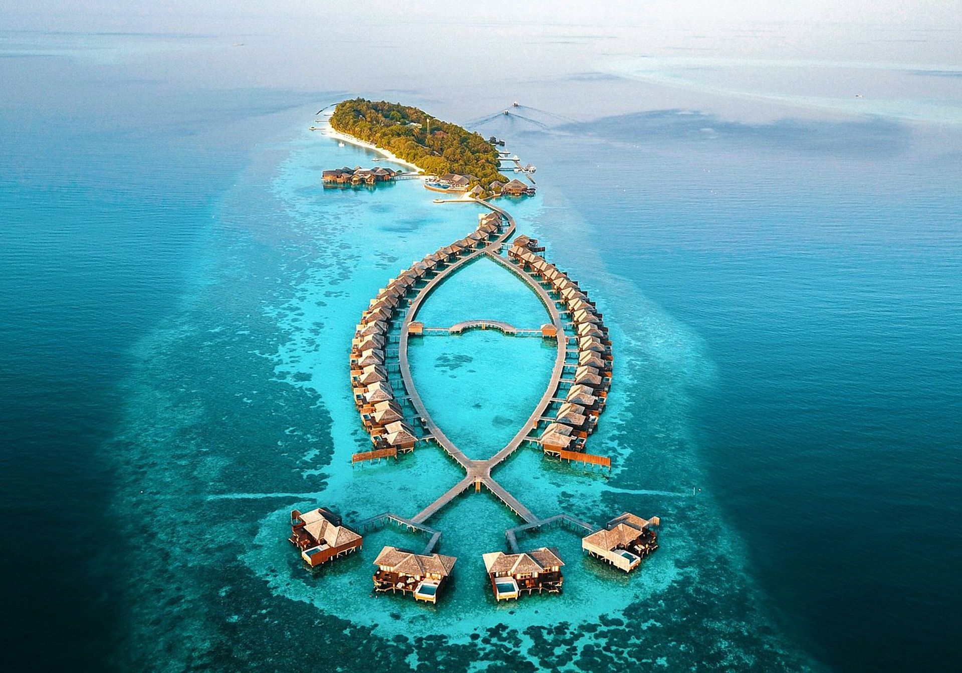 Couple lying on a bed over the sea