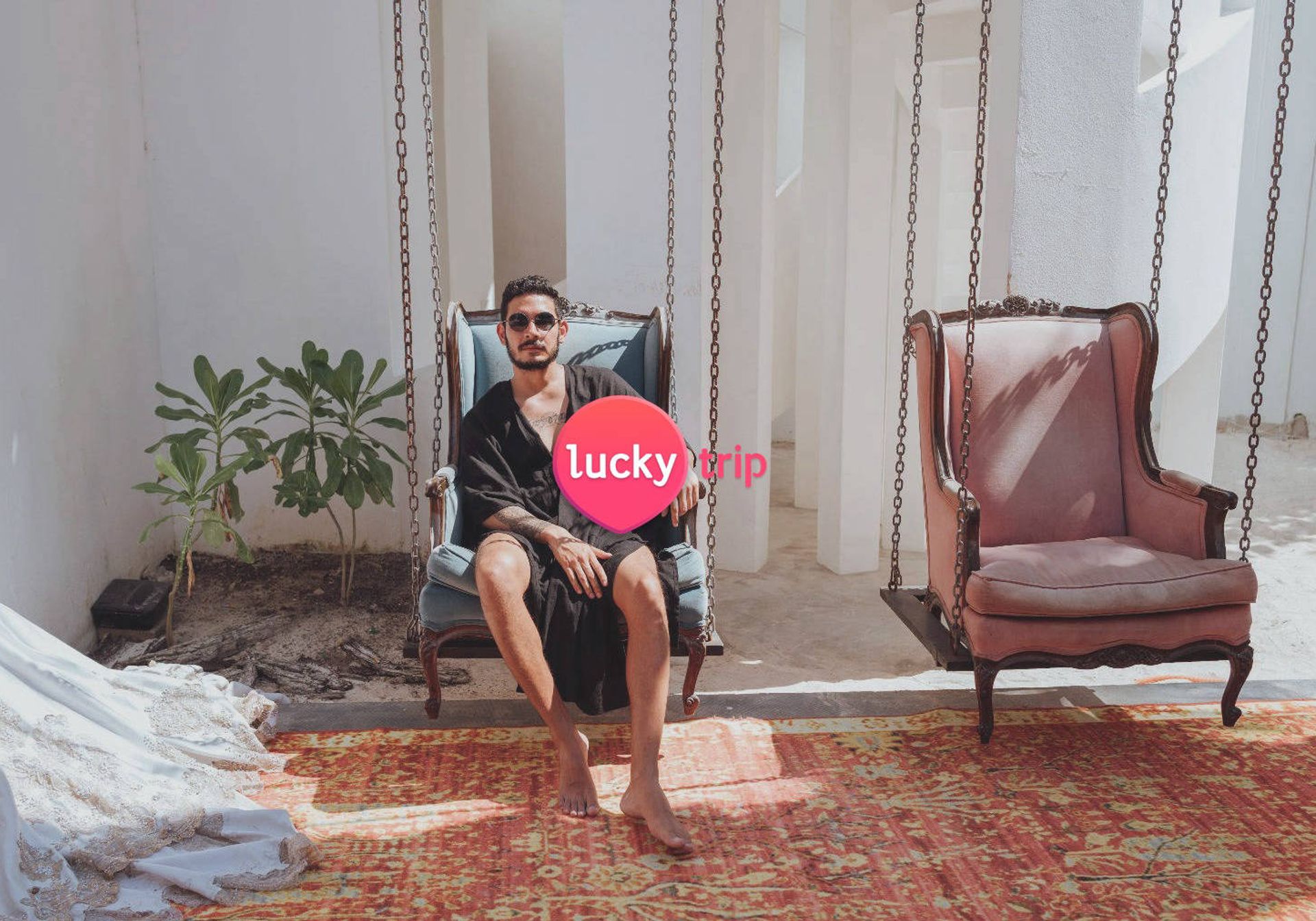 Man in armchair on sunny patio