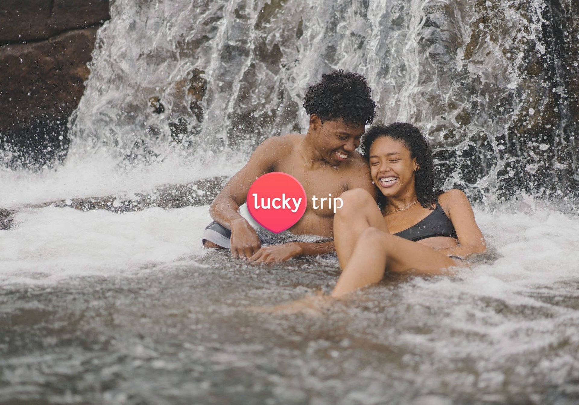 Couple in a waterfall in Thailand