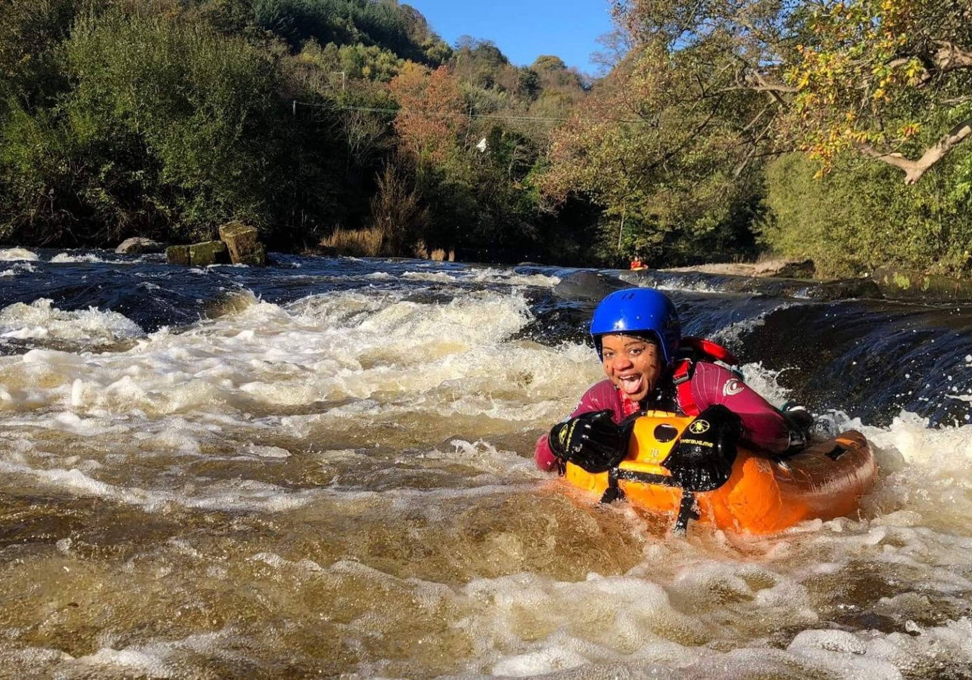 woman floating down a wild river