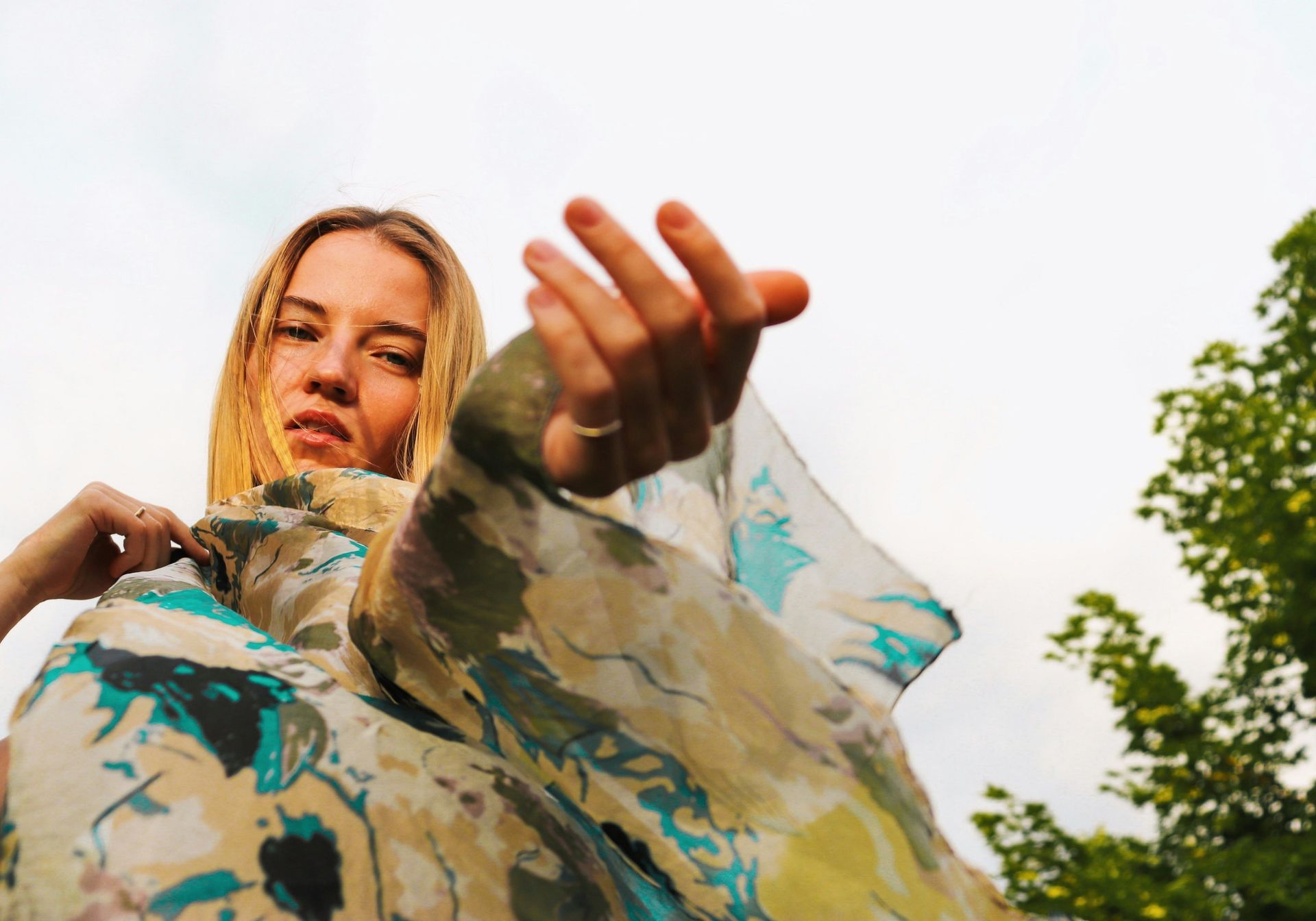 Woman in a golden dress with floral background