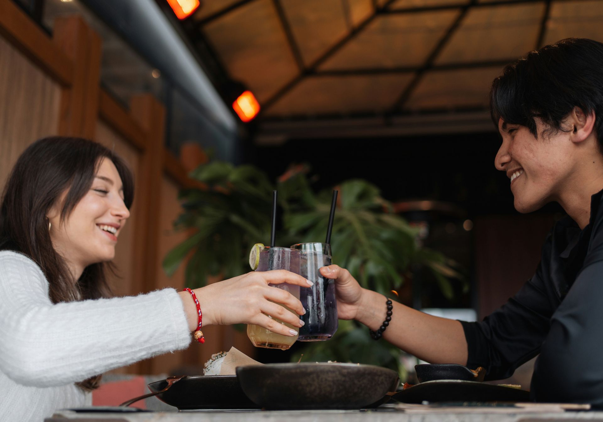 people eating while toasting drinks