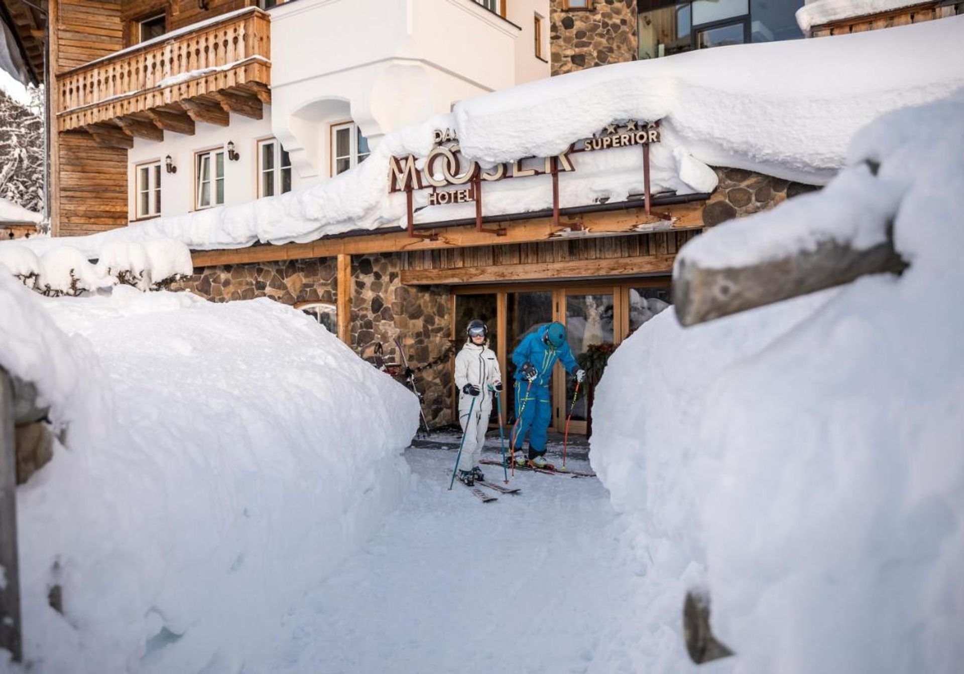 girl overlooking the snowy mountains from hotel mooser