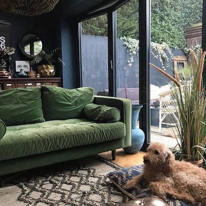 Green sofa by French sliding doors