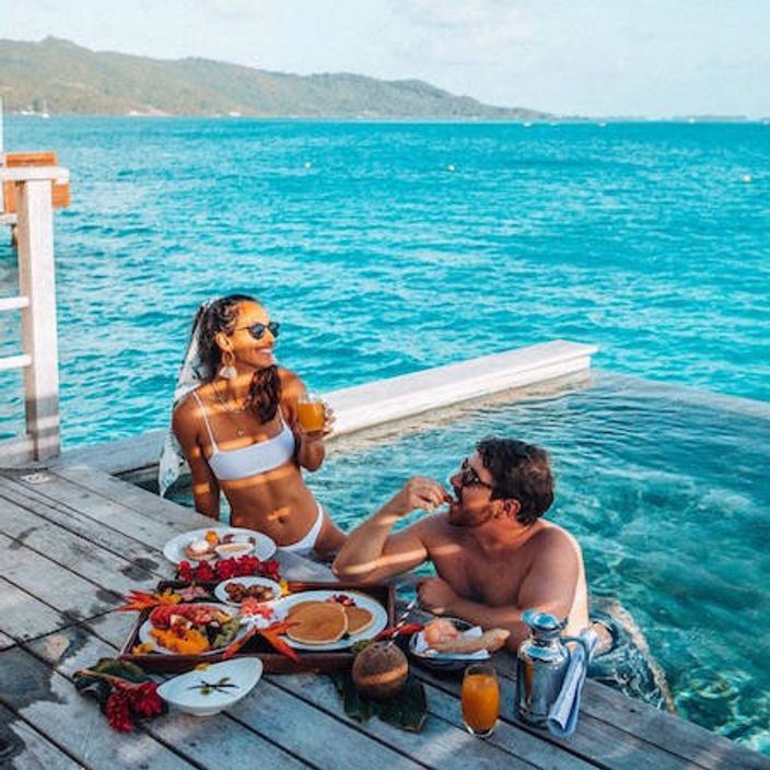 Romantic breakfast at an overwater bungalow