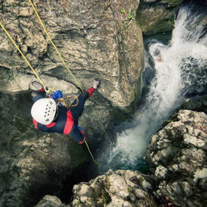 person canyoning in slovenia