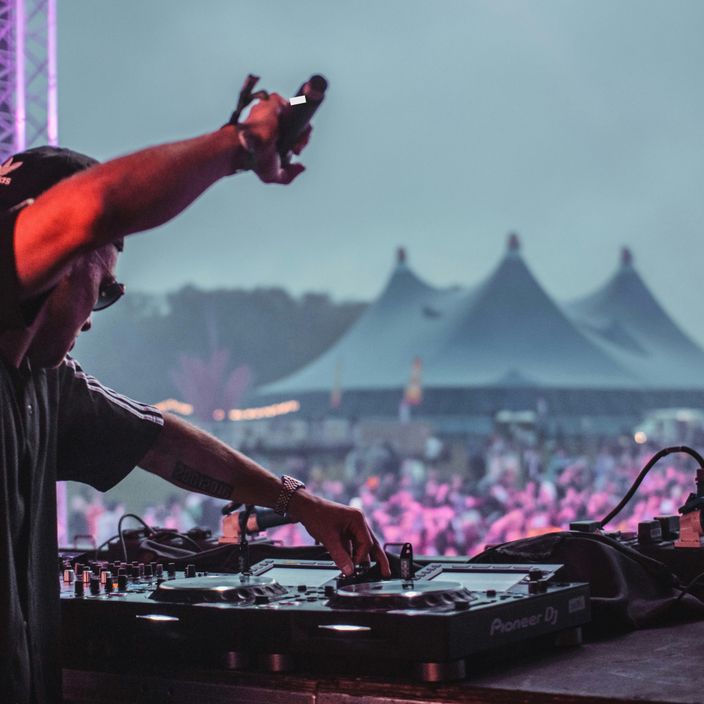 dj playing in front of a crowd at Coachella
