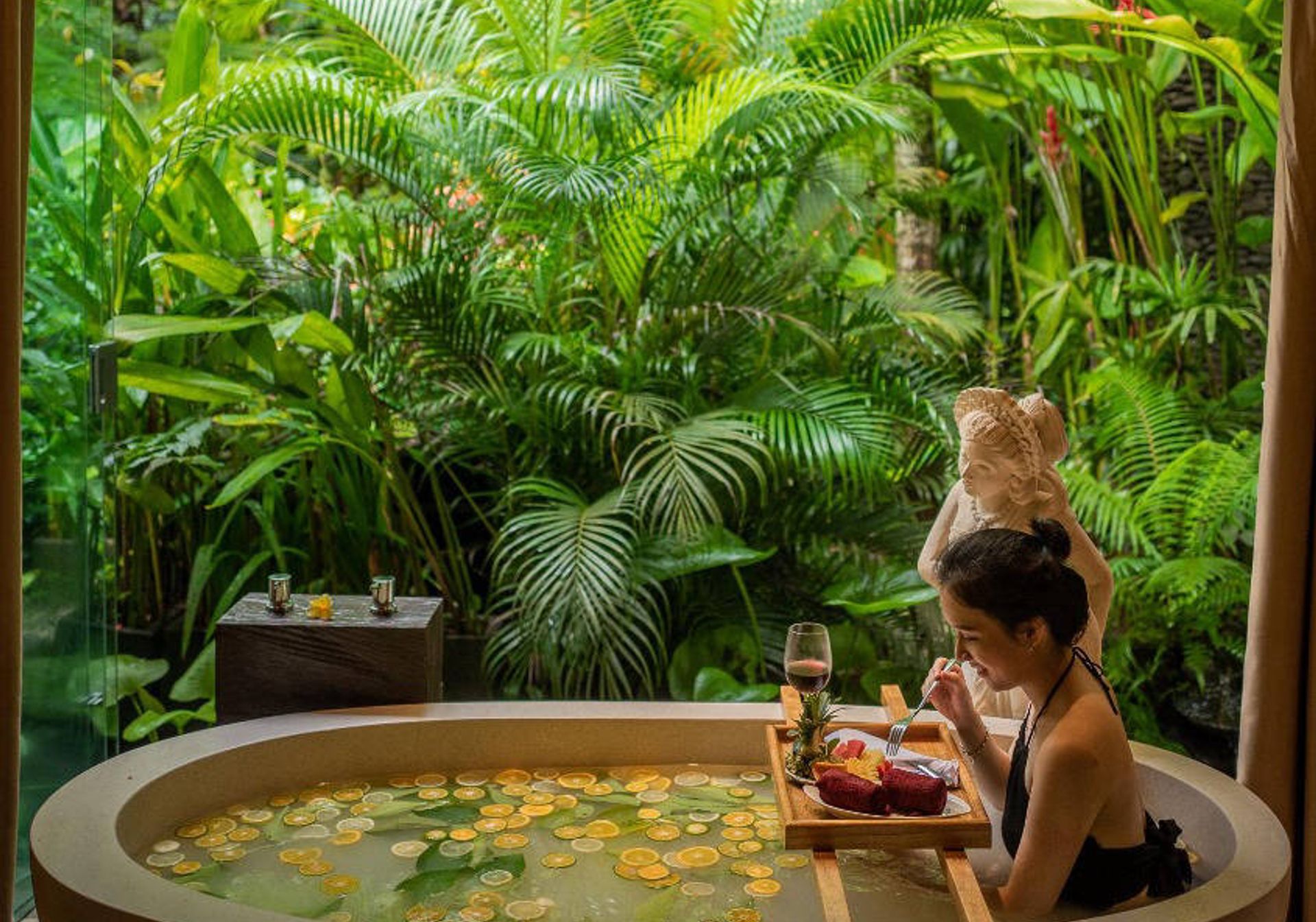 girl in bath in bali udaya resort