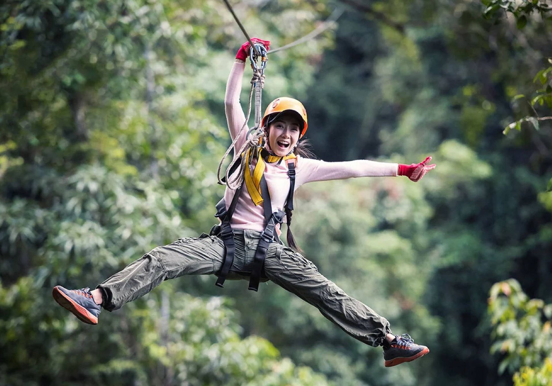 Girl swinging on zip line