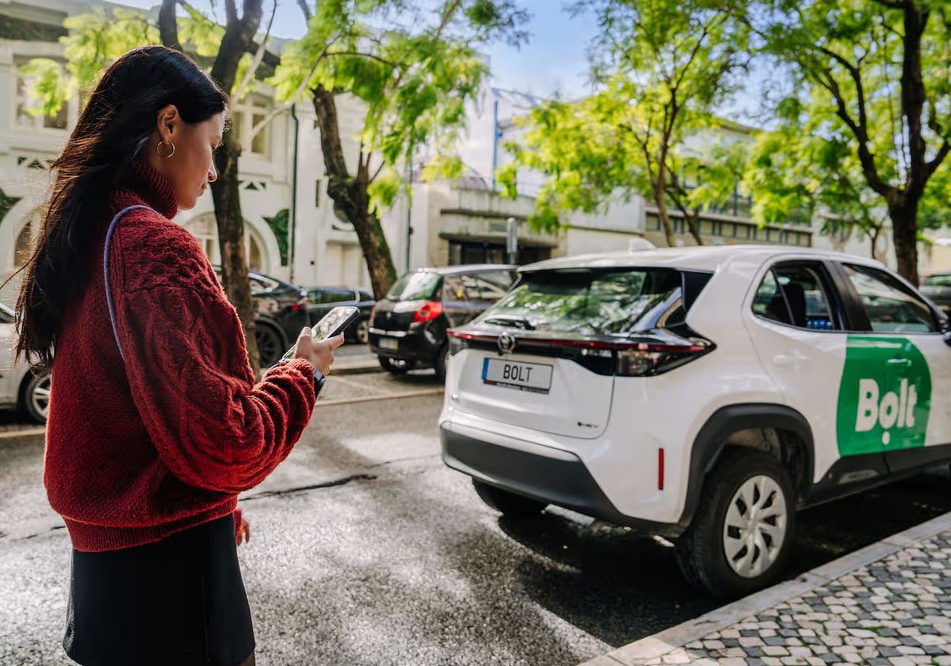 woman taking a bolt cab