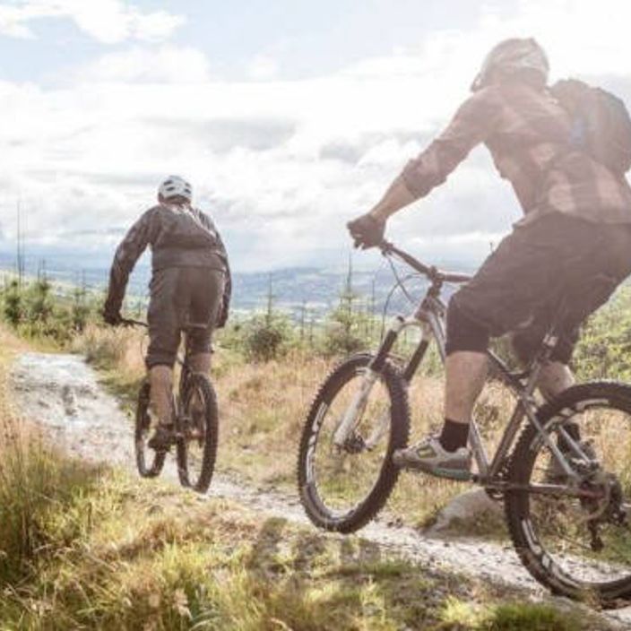 two men mountain biking