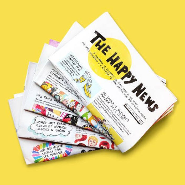 Folded copies of the newspaper with yellow background