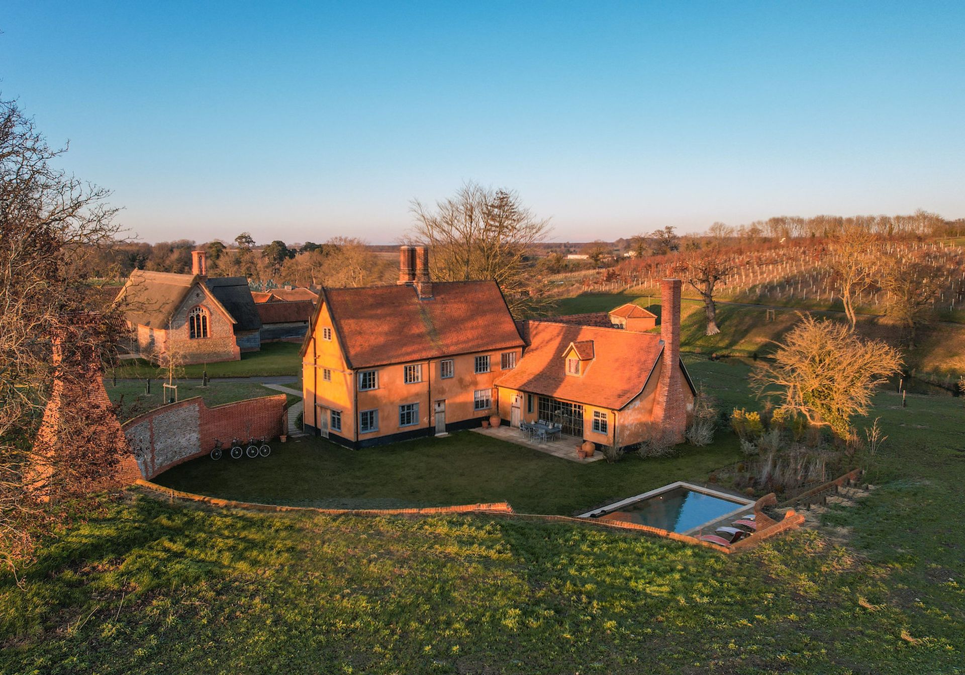Beautiful Traditional Suffolk Farmhouse exterior with pool