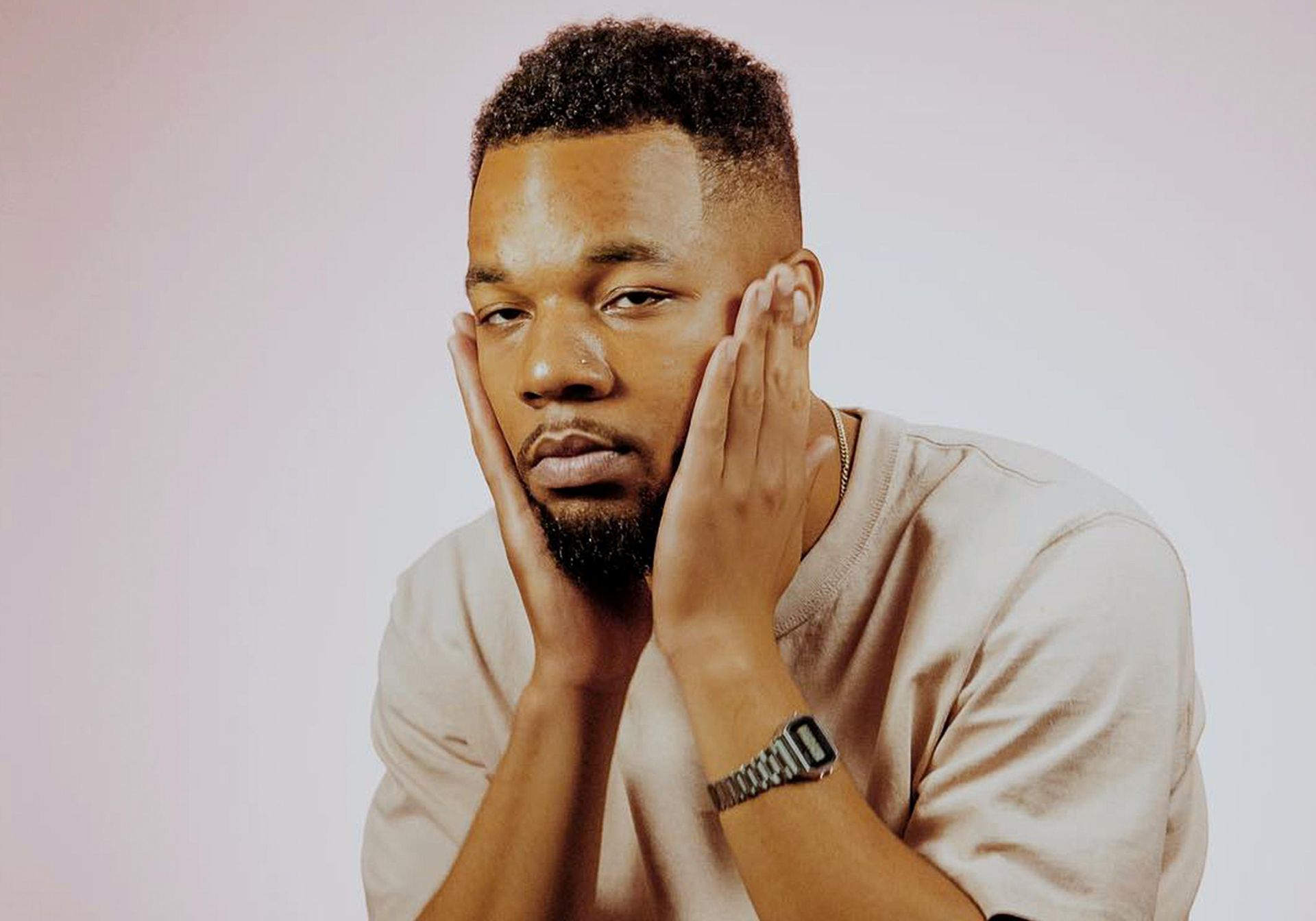 man refreshing his face