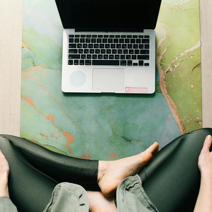 a burning incense stick surrounded by moss