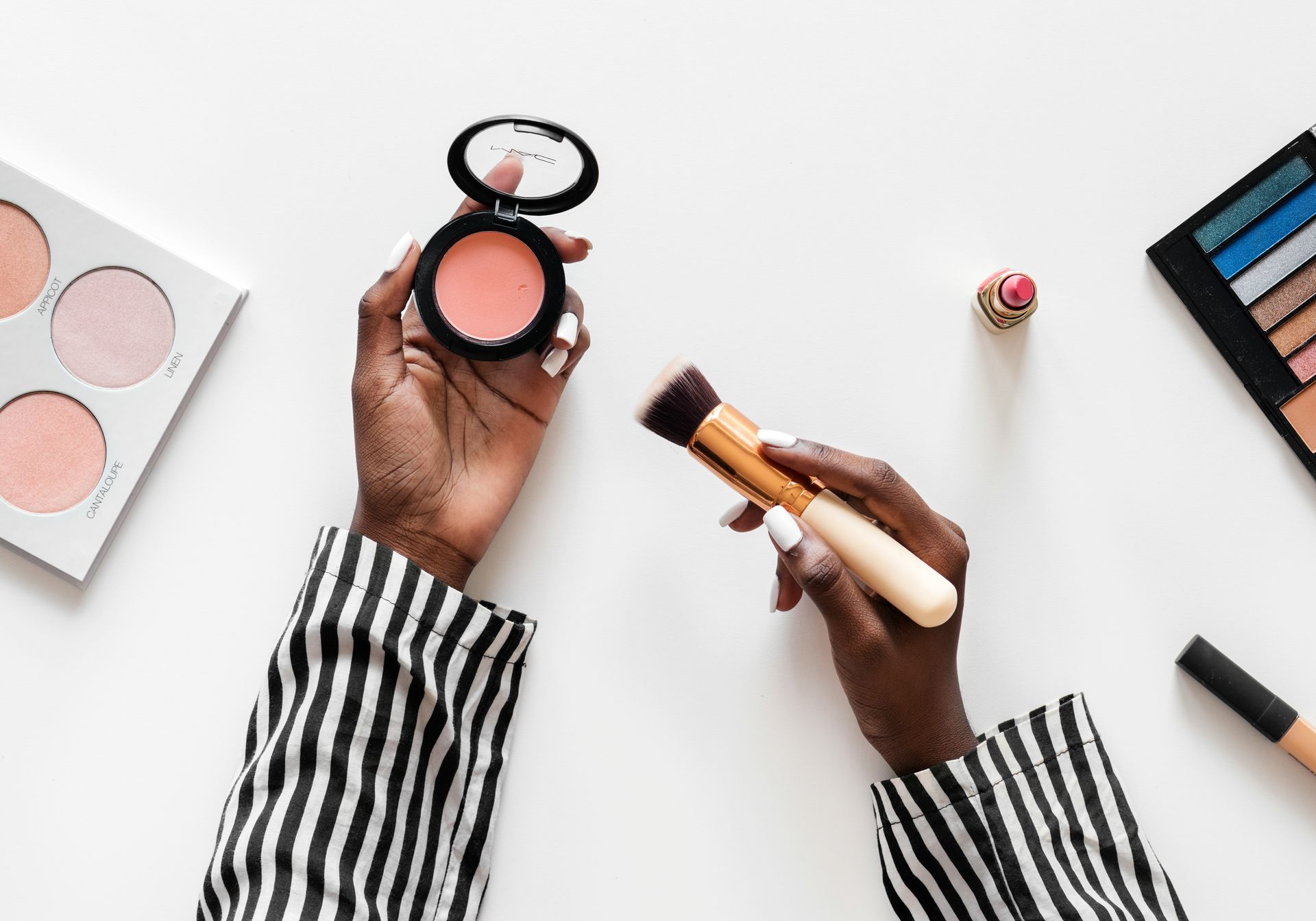 woman using blush cosmetics