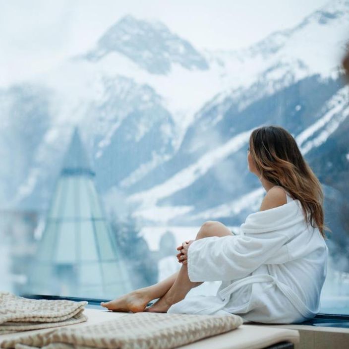 girl looking out on the aqua dome hotel in winter
