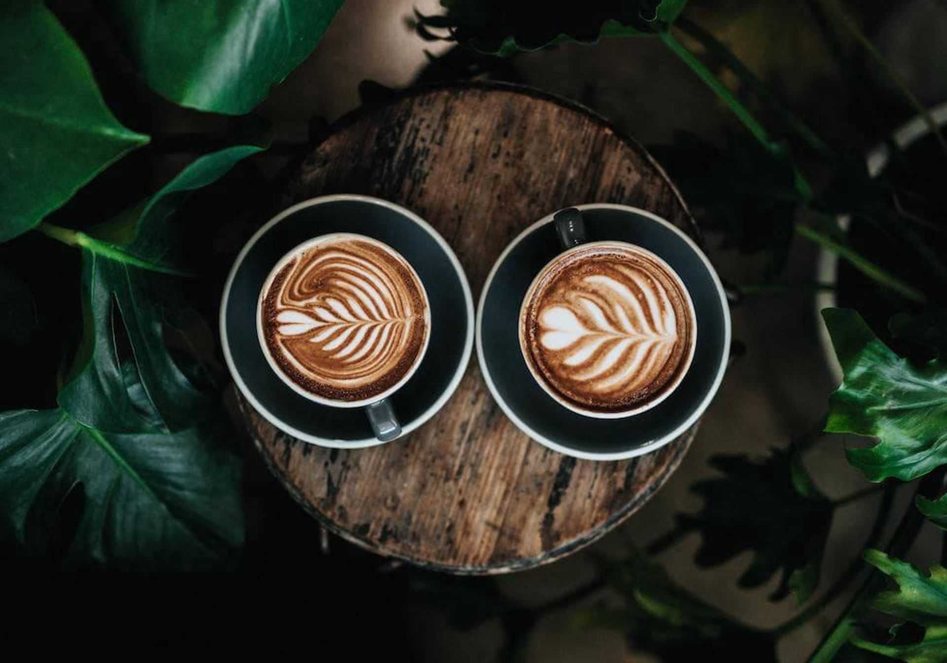  Two coffee cups with coffee art 