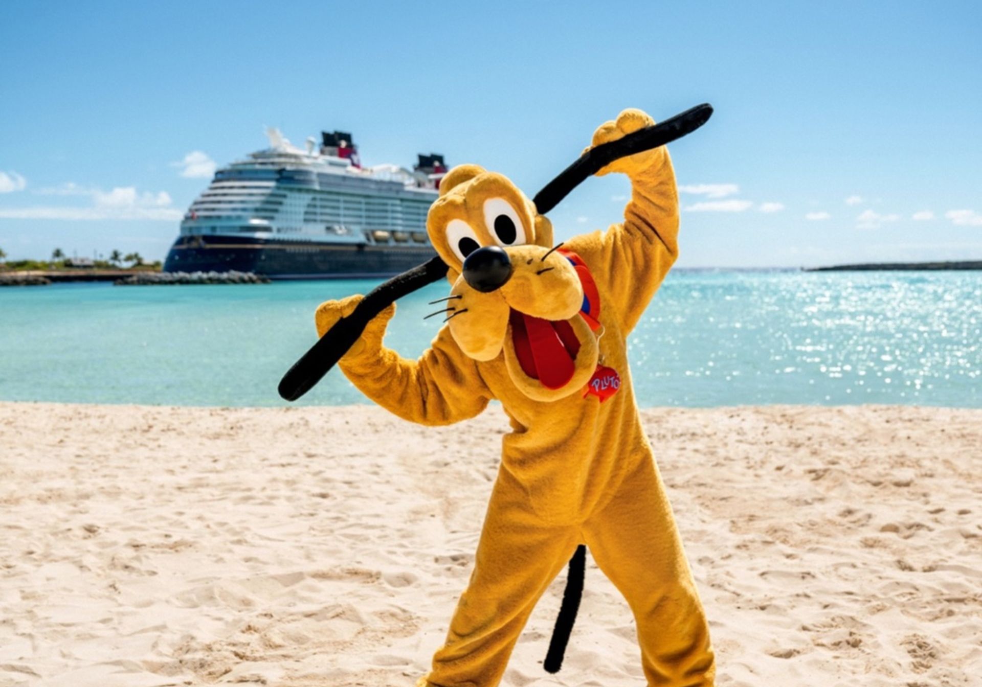 Goofy on a beach in front of disney cruise in the caribbean