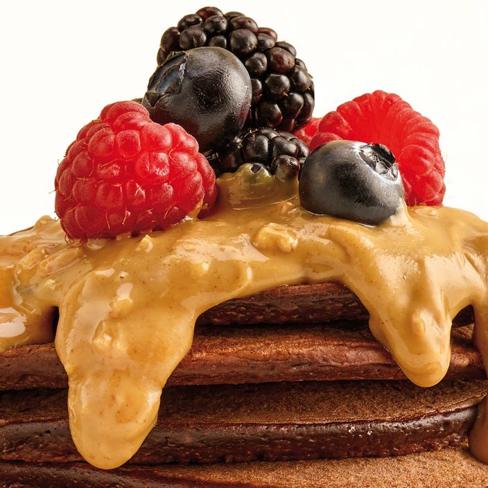 nut butter being spread on bread