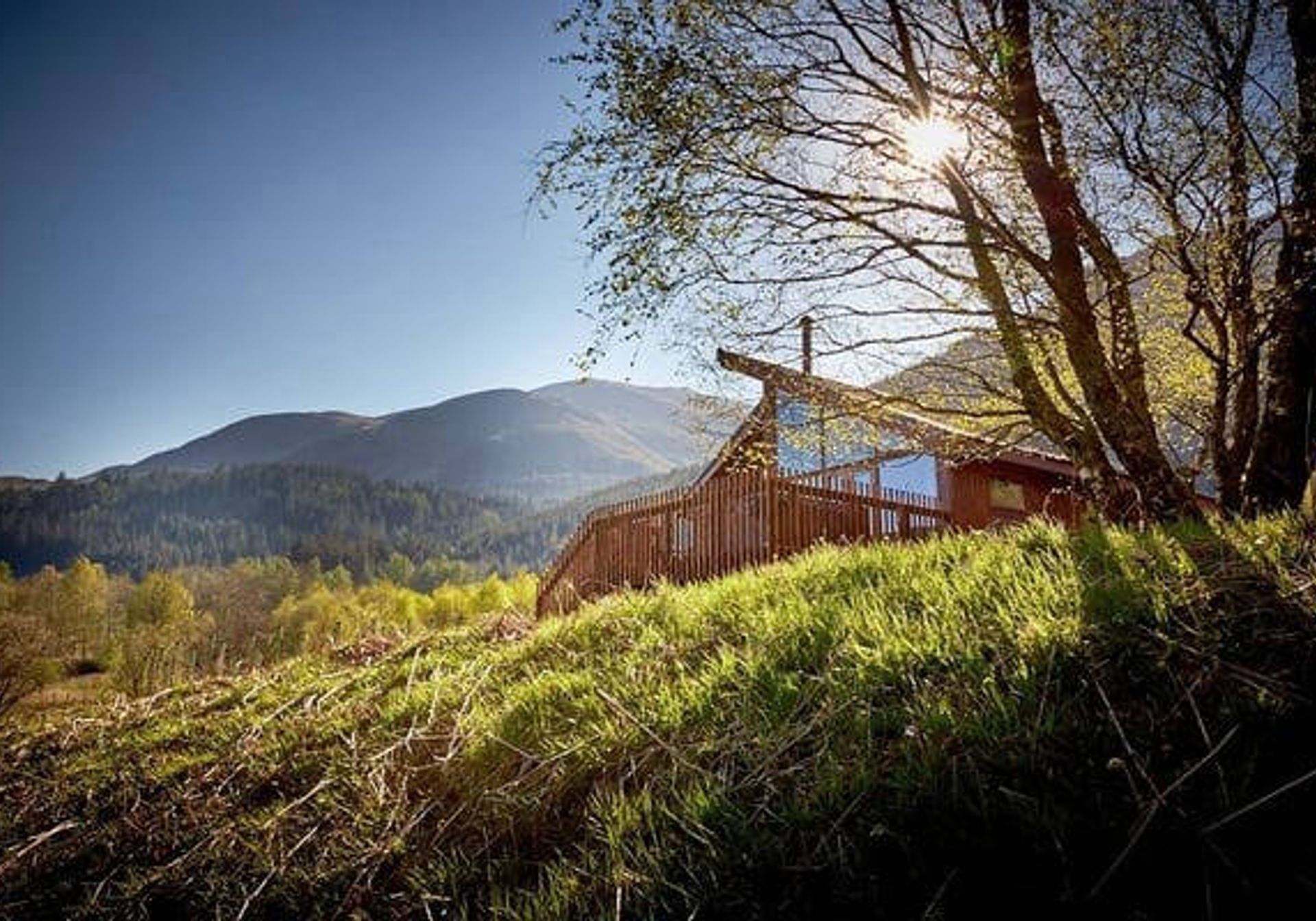 Cabin in the hills with the sun shining through