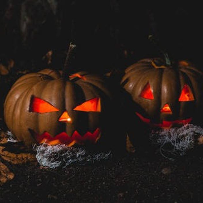 Two Halloween pumpkins carved with faces 