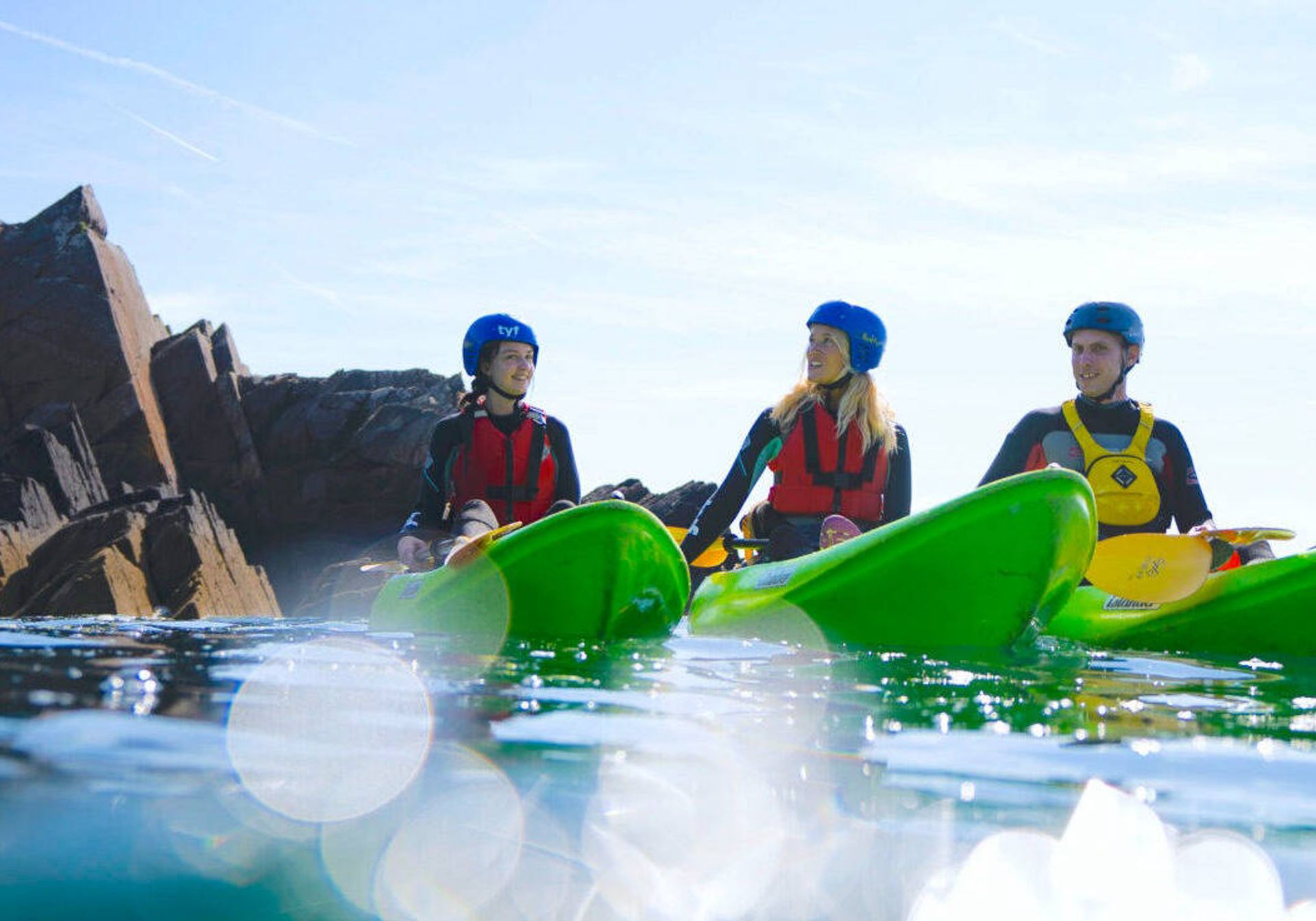 3 people kayaking in wales