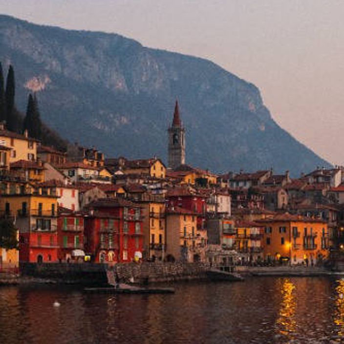 a village at sunset by lake como