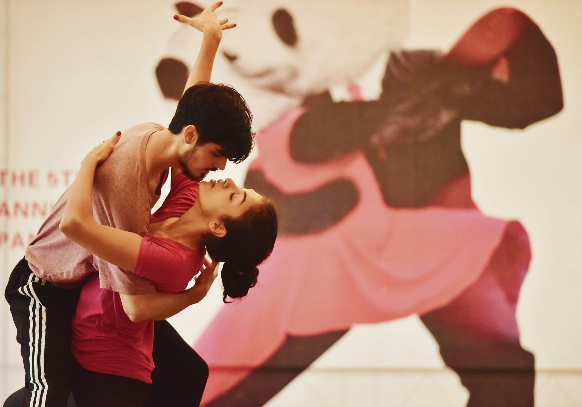 man and woman dancing to salsa