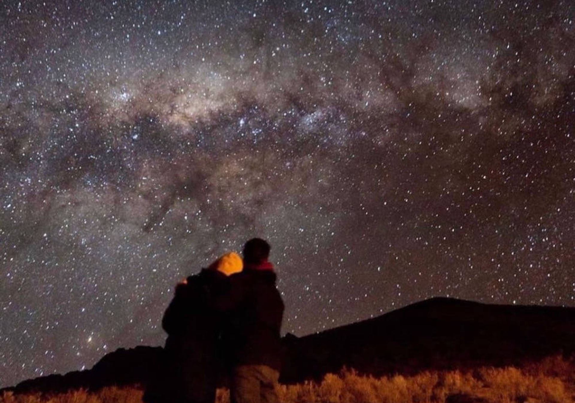 Couple stargazing in Chile
