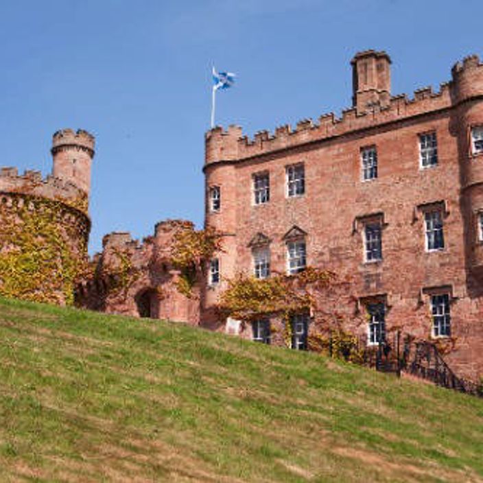 A majestic red brick castle stay