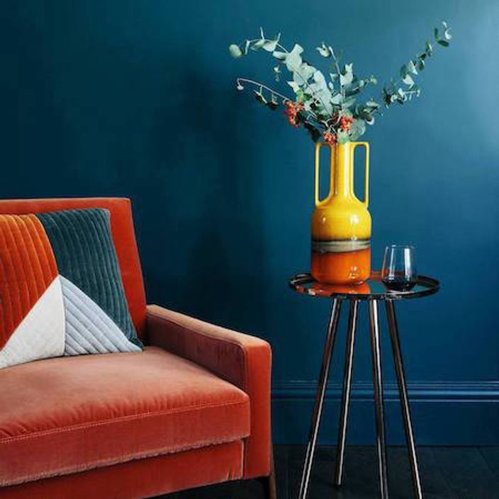 Armchair, side table and vase