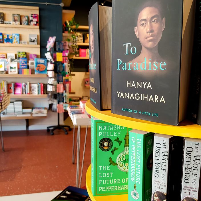 The Common Press store front with their logo and a welcome message