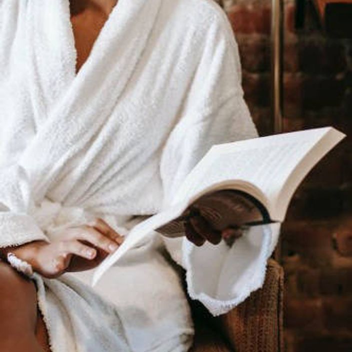A women at a spa reading a book