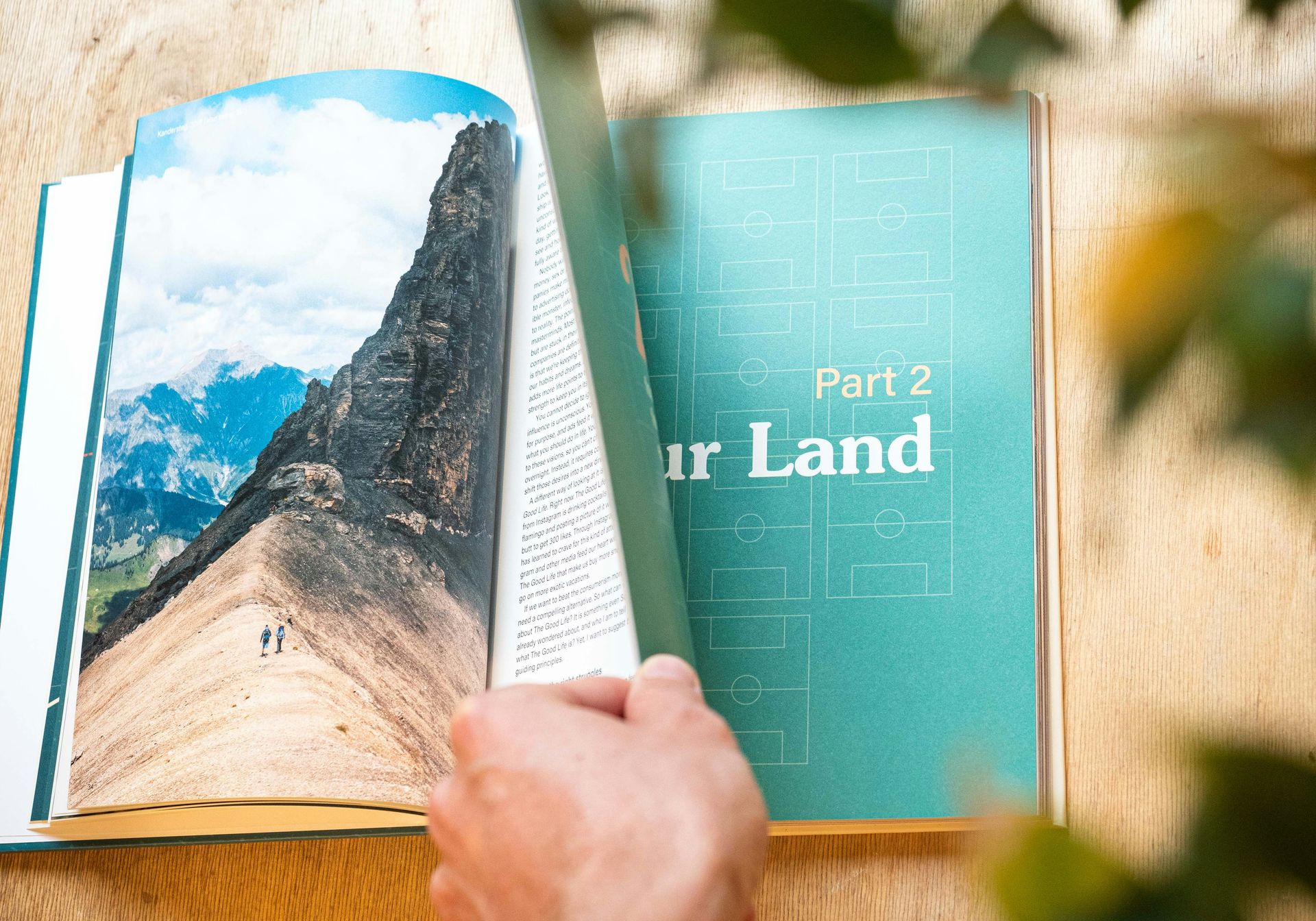 person turning page in book