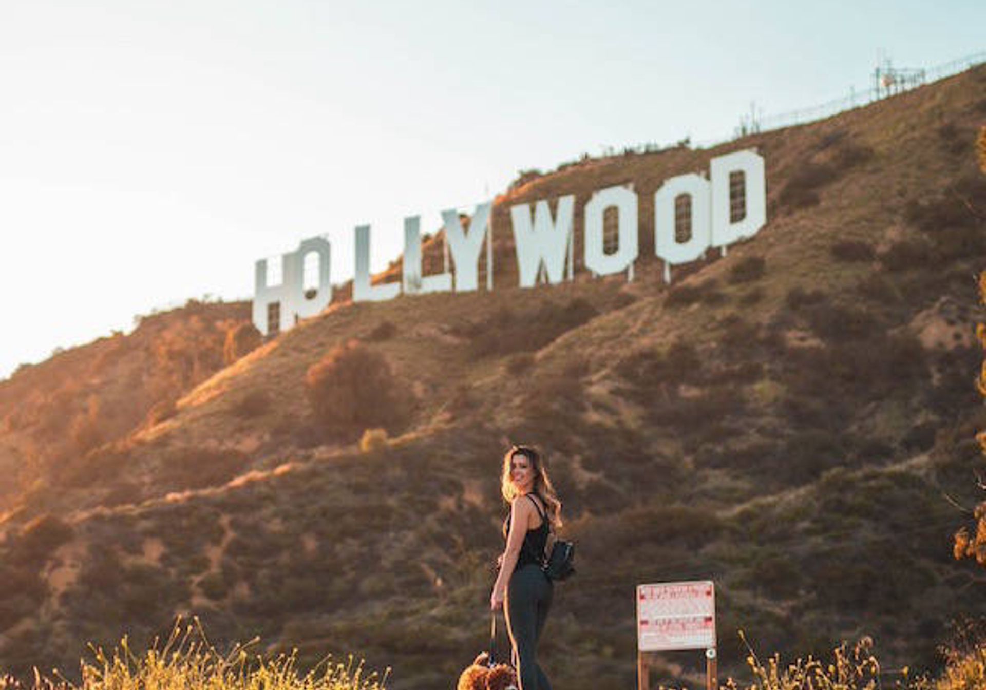 Woman in front of Hollywood sign