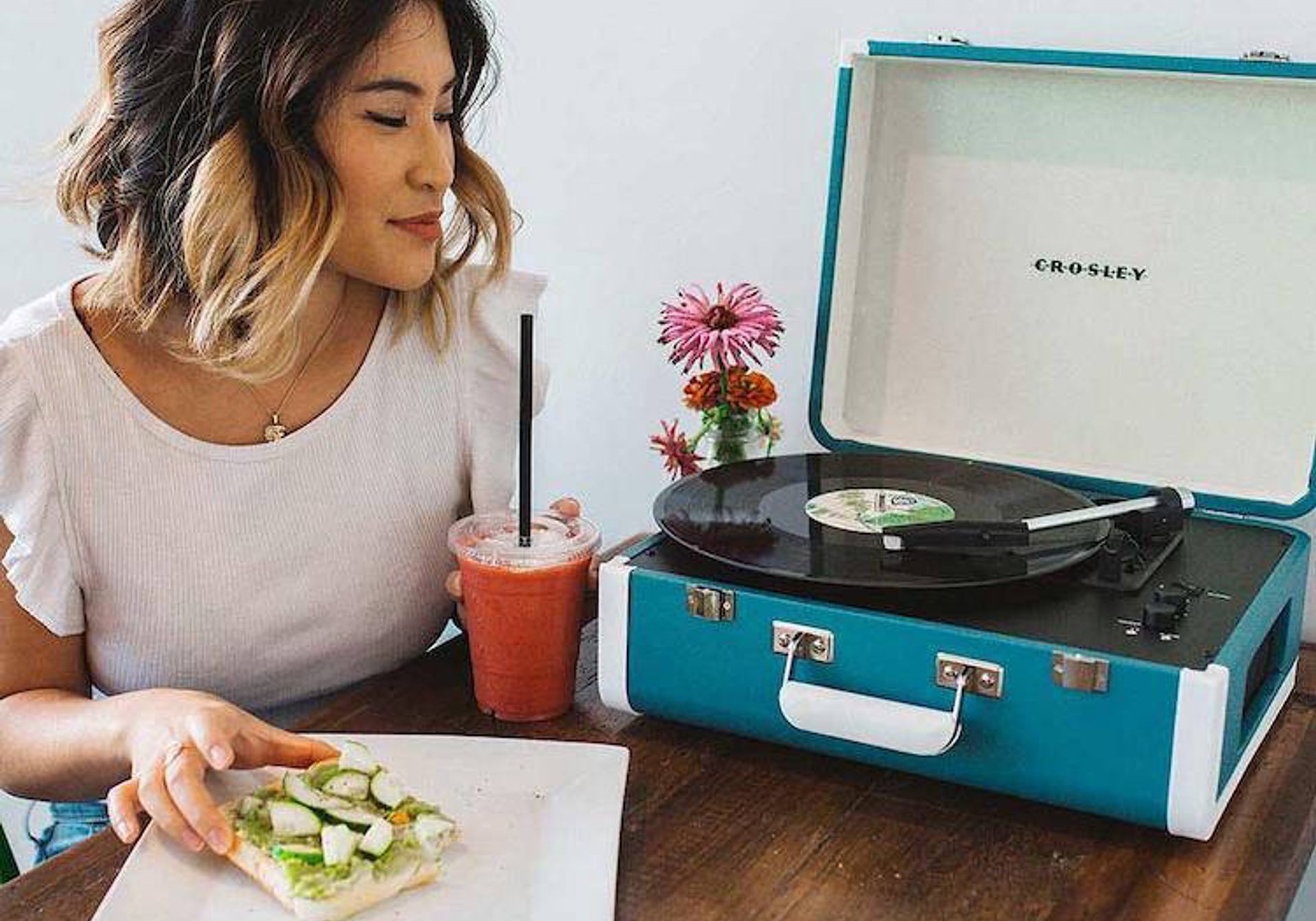 Woman with the Crosley Cruiser vinyl record player