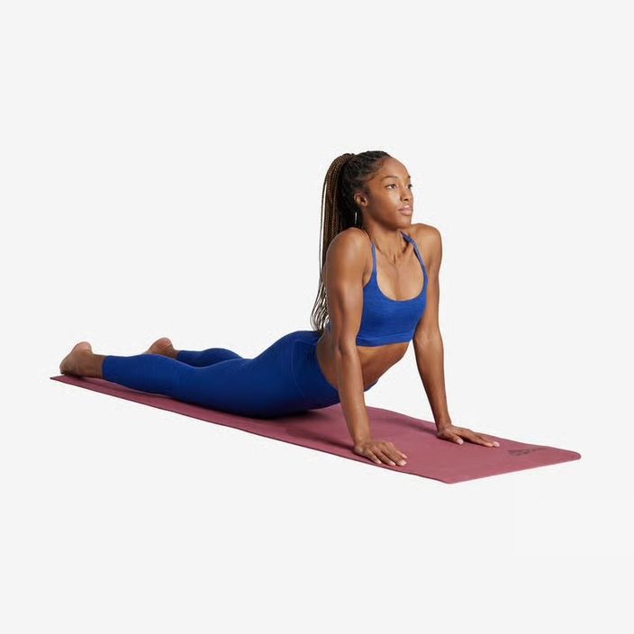 girl doing a yoga pose in lululemon clothing