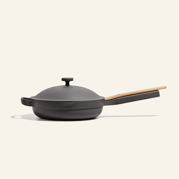 light grey ourplace pan on a kitchen top next to brown glasses