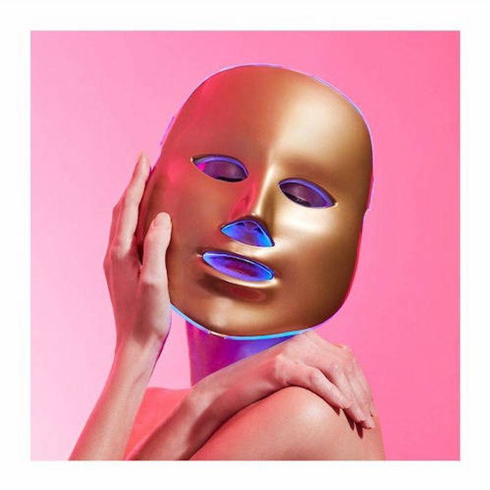 Person wearing MZ Skin golden facial treatment mask