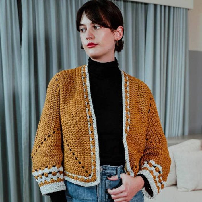 Woman wearing turmeric recycled bottle crochet cardigan