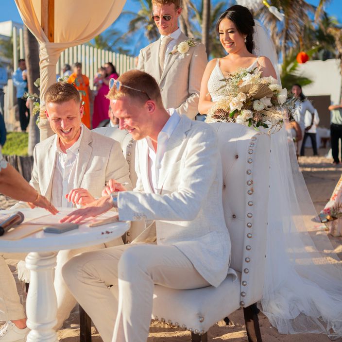 two men walking happy out of chapel after wedding