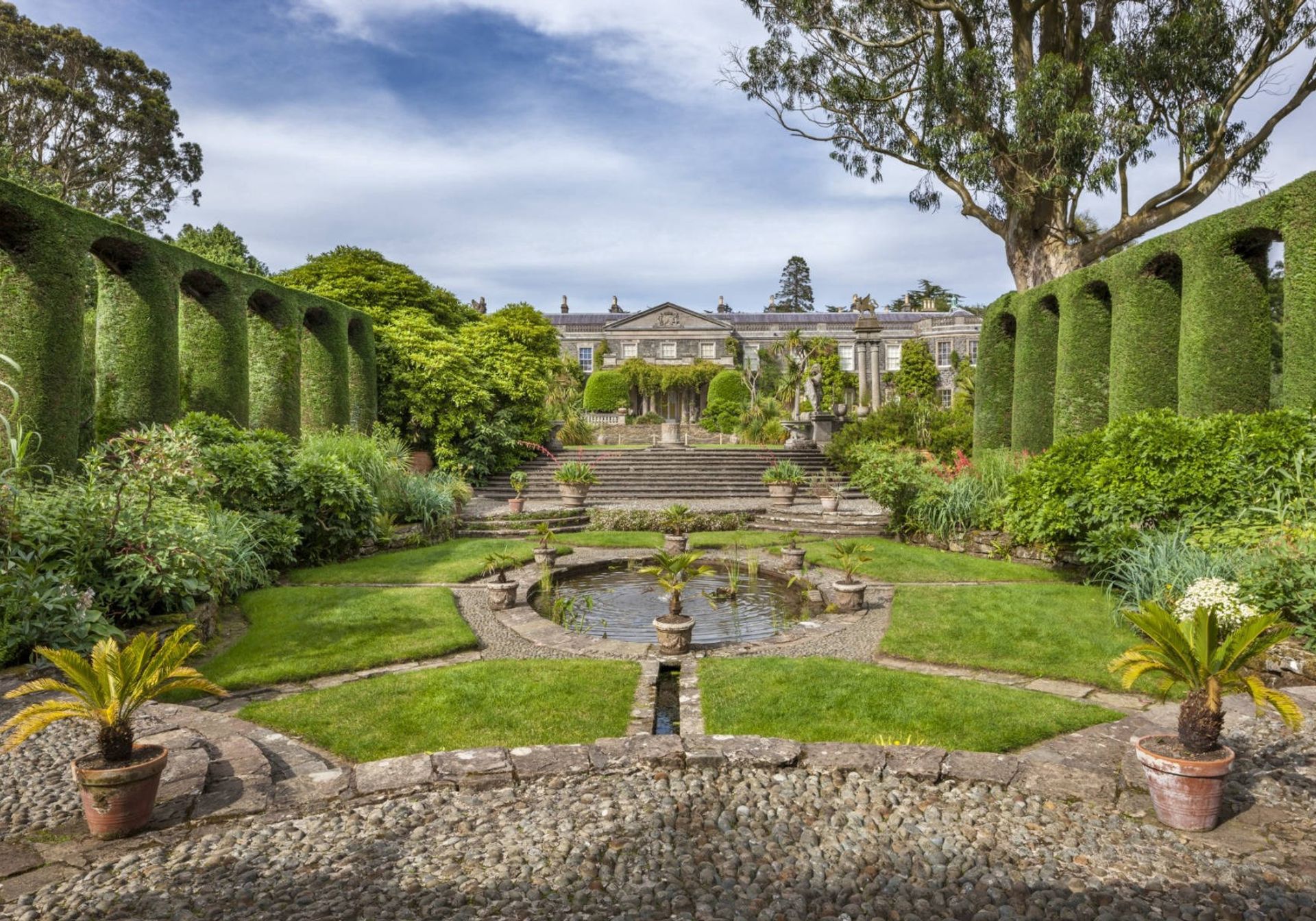 a couple walking around a National Trust grounds