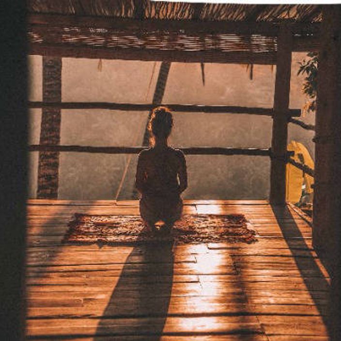 girl doing yoga in bali at sunrise